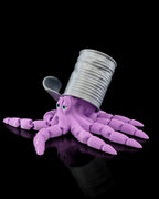 Gus the Octopus purple articulated 3D printed toy with eight arms wearing a silver can from 3DPRINTSWA Articulated Animals collectible desk accessory.