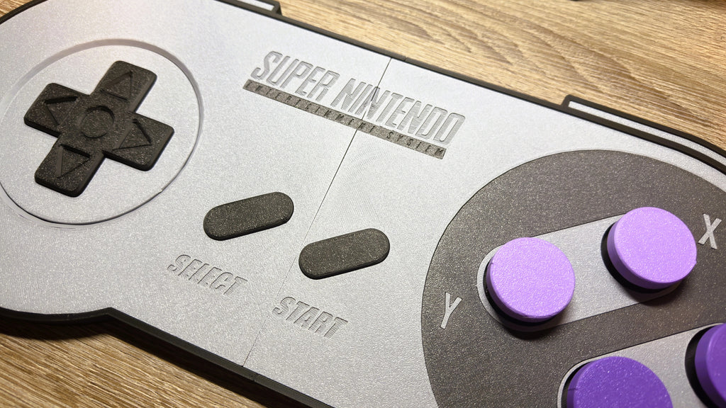 Detail view of retro SNES controller wall decor with functional clicker buttons