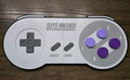 3D printed clickable SNES controller wall art with functional purple keyboard clicker buttons