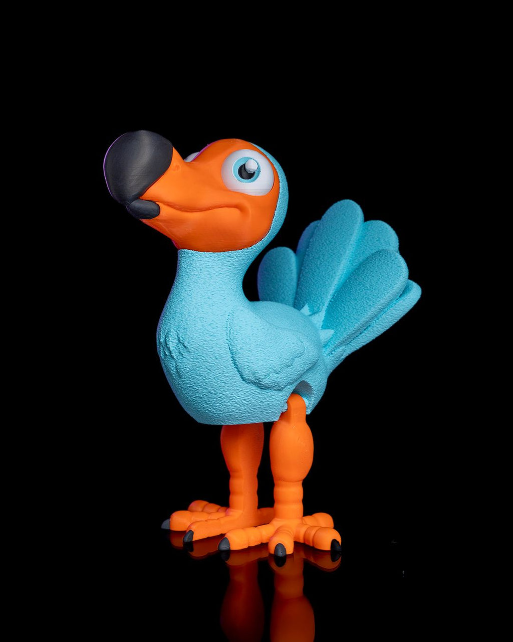Articulated Dodo 3D printed blue and orange bird figurine with flexible joints and detailed wings by 3DPRINTSWA for playful desk display