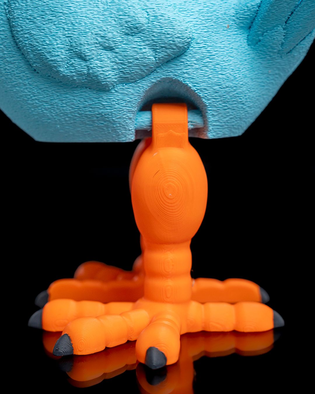 Articulated Dodo orange 3D printed bird toy with flexible legs and toes by 3DPRINTSWA from the Articulated Animals Featured collection for fidgeting and display