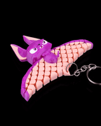 Bat Keychain in purple and pink with articulated segmented wings and metal ring by 3DPRINTSWA a playful animal collectible and 3D printed toy