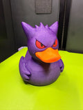 Front view of Gengar Duck Pokémon mashup figure with purple body, red eyes, and orange bill
