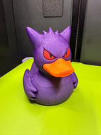Front view of Gengar Duck Pokémon mashup figure with purple body, red eyes, and orange bill