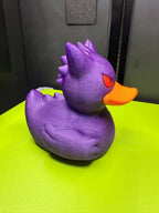 Right-side view of Gengar Duck Pokémon mashup figure showing purple body, wing, spikes, red eye, and orange bill