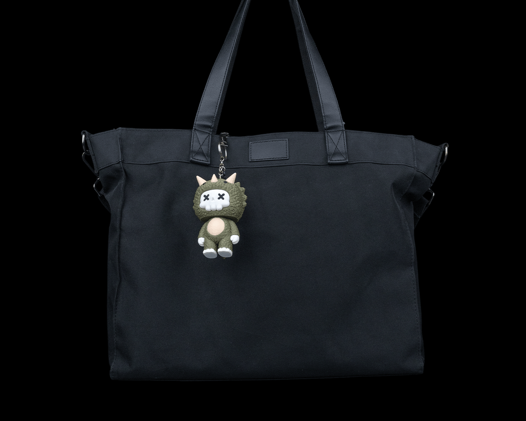 Trixi skeleton triceratops keychain charm attached to a black tote bag by 3DPRINTSWA in the Keychains Animals collection