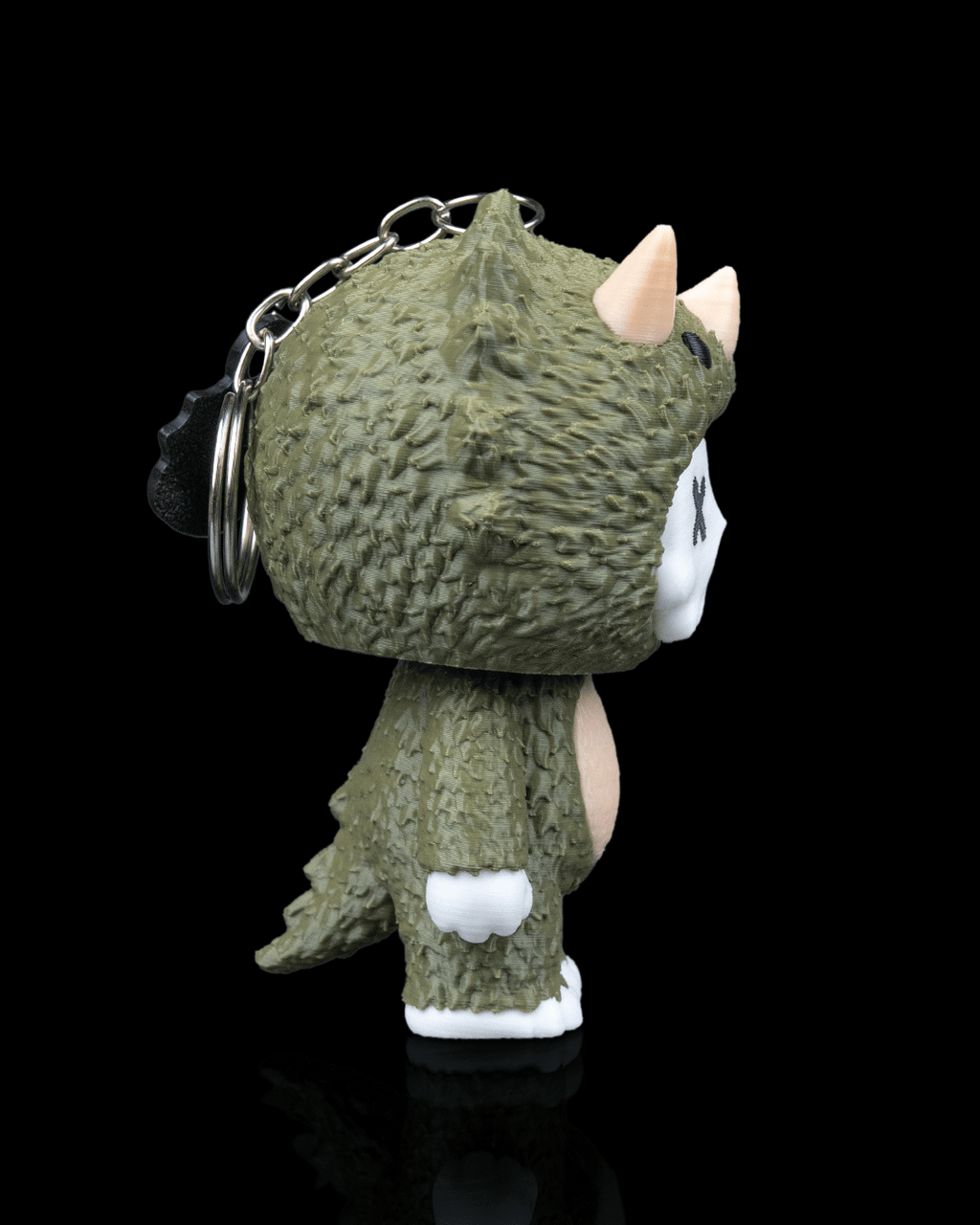 Trixi by 3DPRINTSWA 3D printed triceratops skeleton keychain collectible with textured dinosaur costume detail from Keychains and Animals
