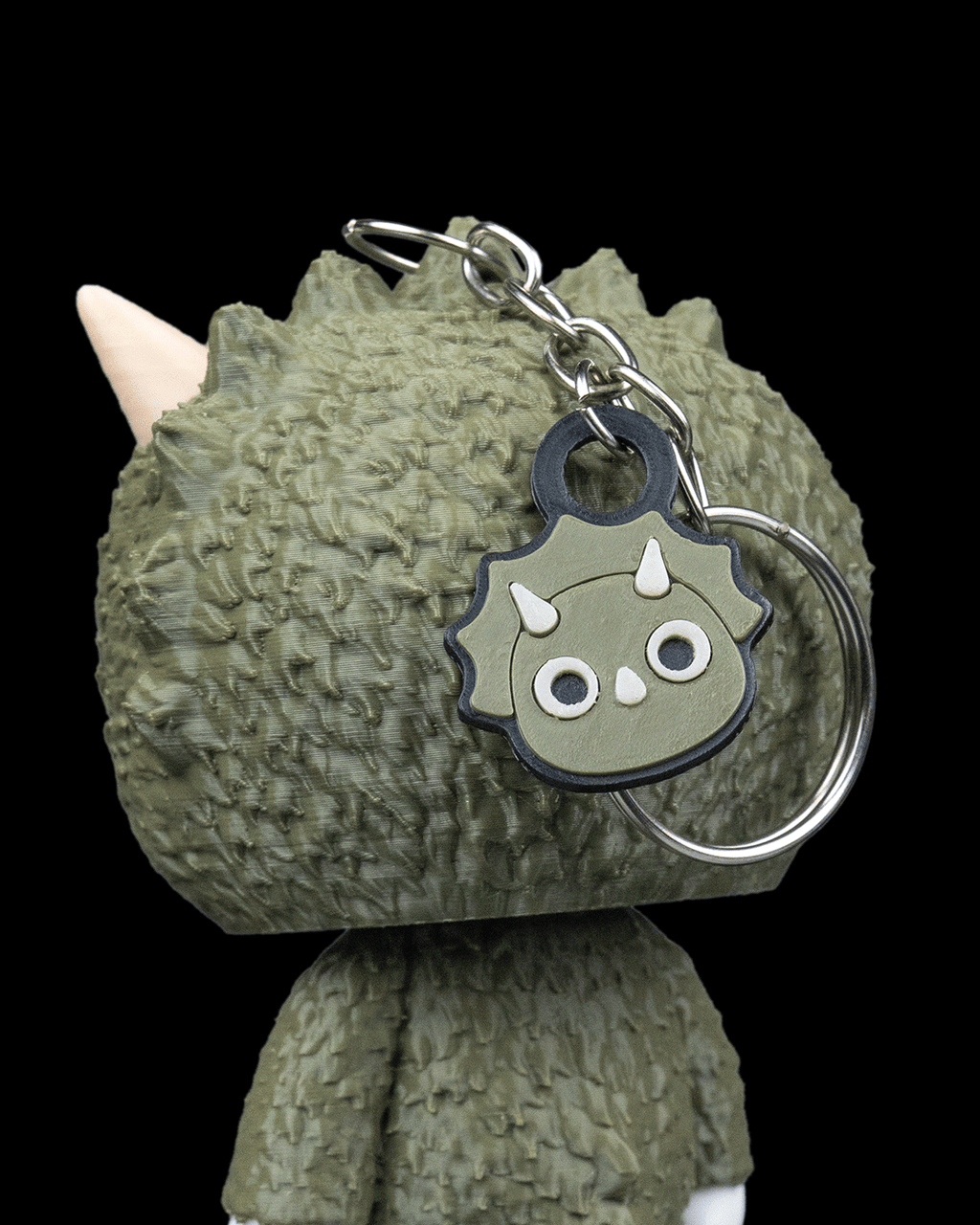 Trixi 3D printed triceratops skeleton keychain with textured dinosaur skin and face charm by 3DPRINTSWA for Keychains Animals and collectible toy fans