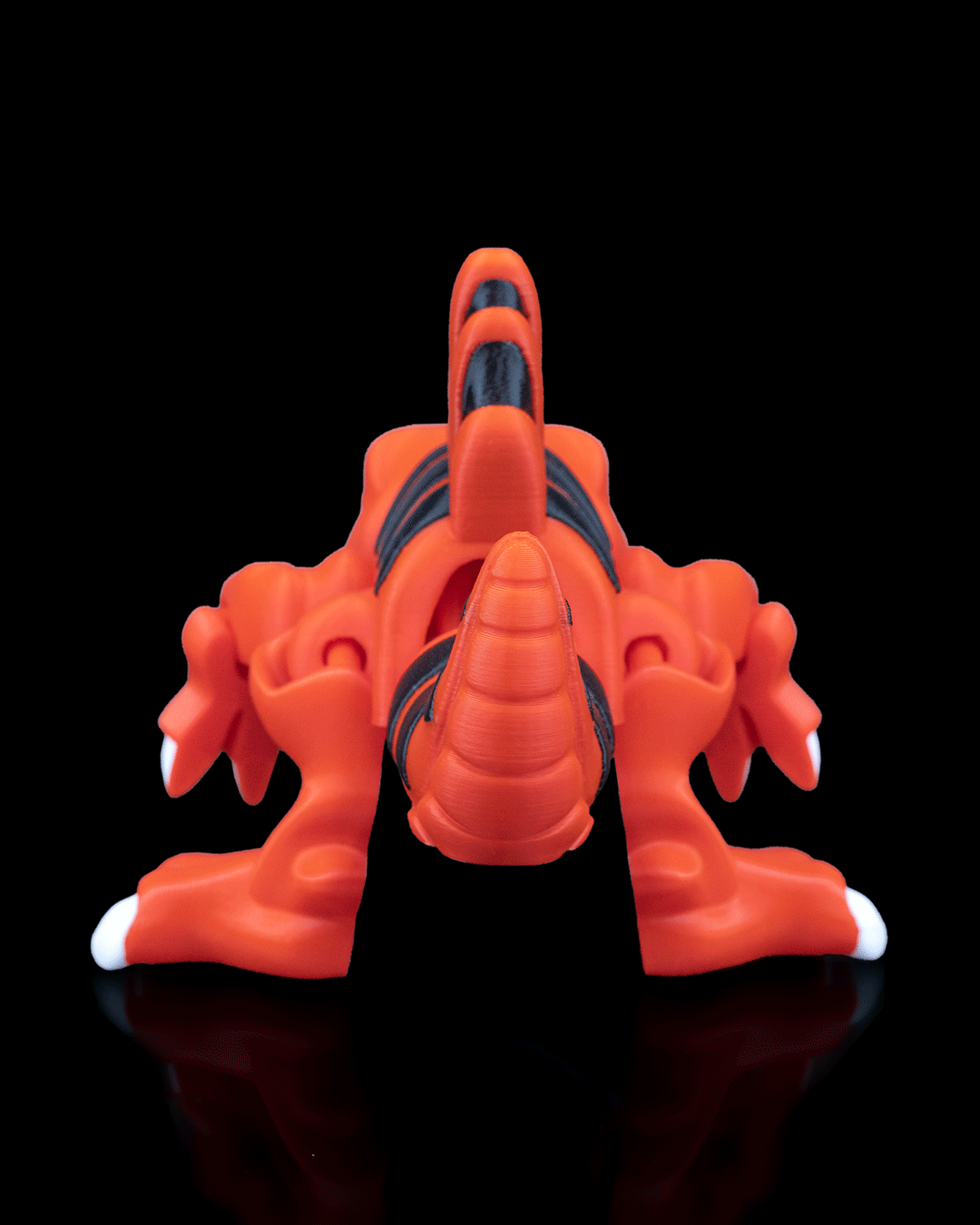 Spinosaurus Flexi Dinosaur bright orange articulated toy with dark accents and broad feet shown from the front by 3DPRINTSWA. Articulated Animals collectible figure