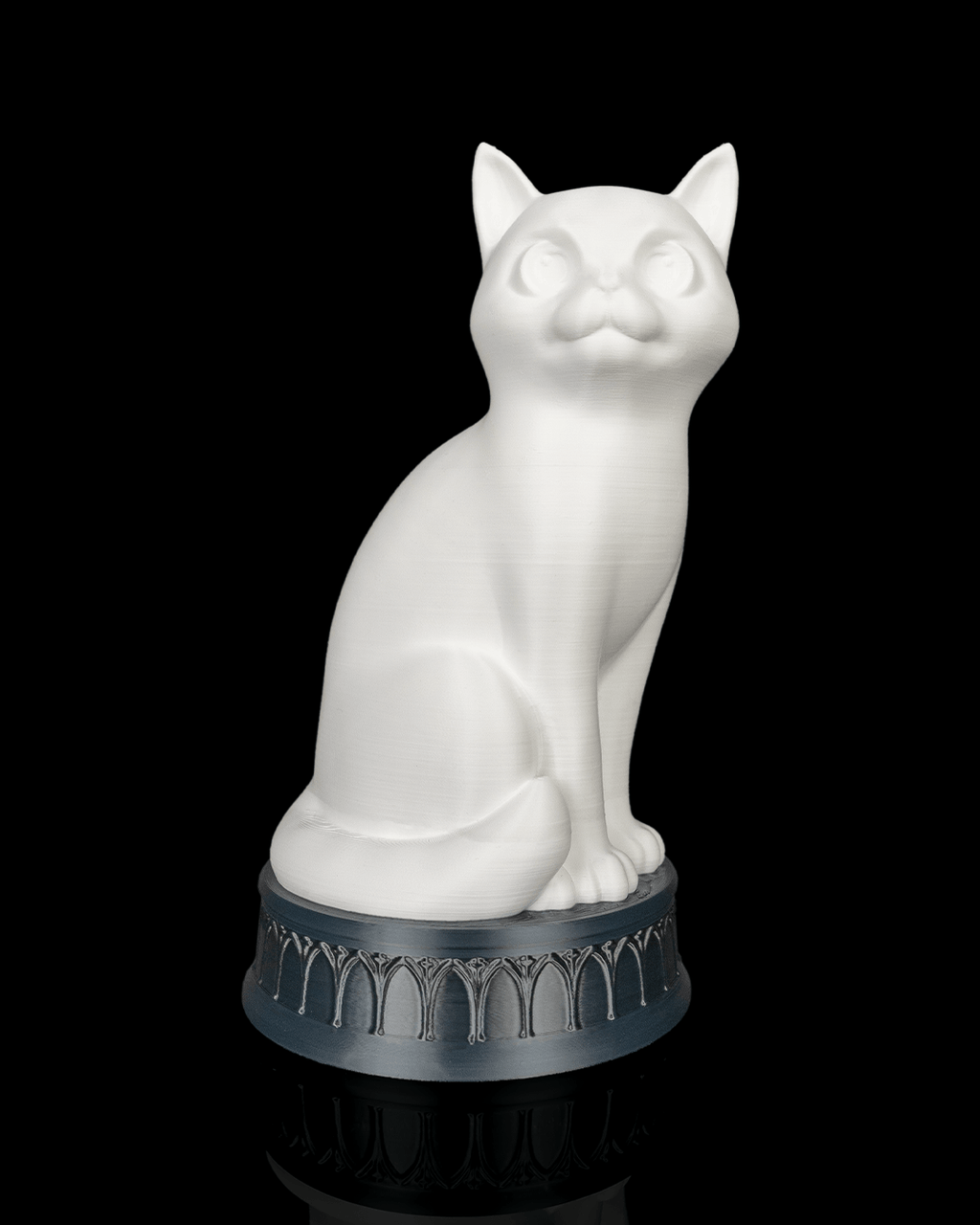X-Ray Cat lamp with the light off, showing a white cat on a dark arch-patterned base