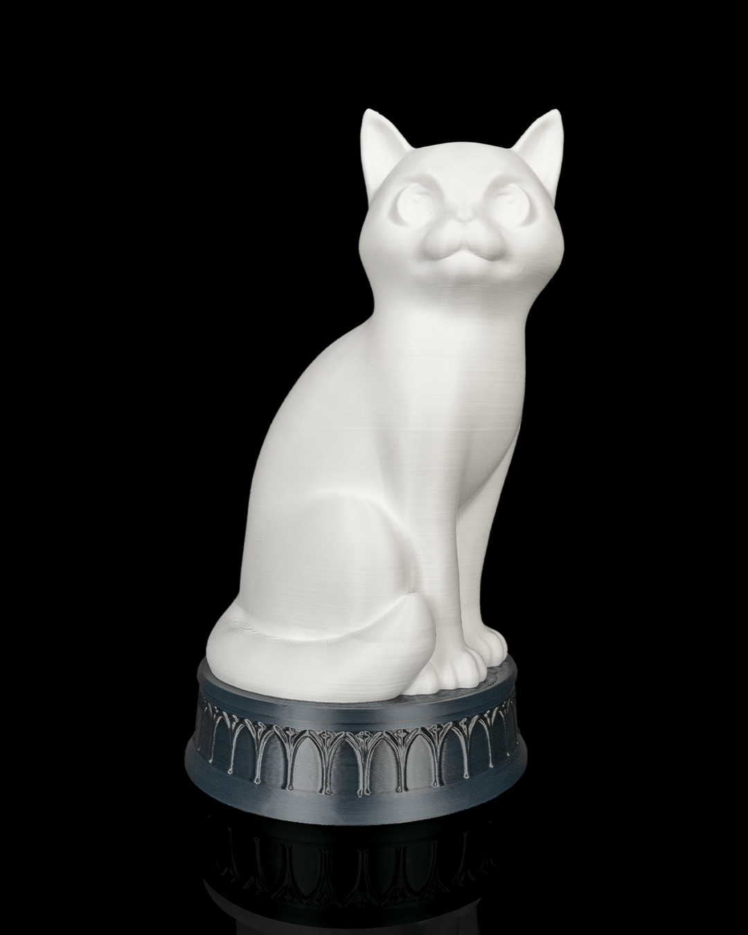 X-Ray Cat lamp with the light off, showing a white cat on a dark arch-patterned base