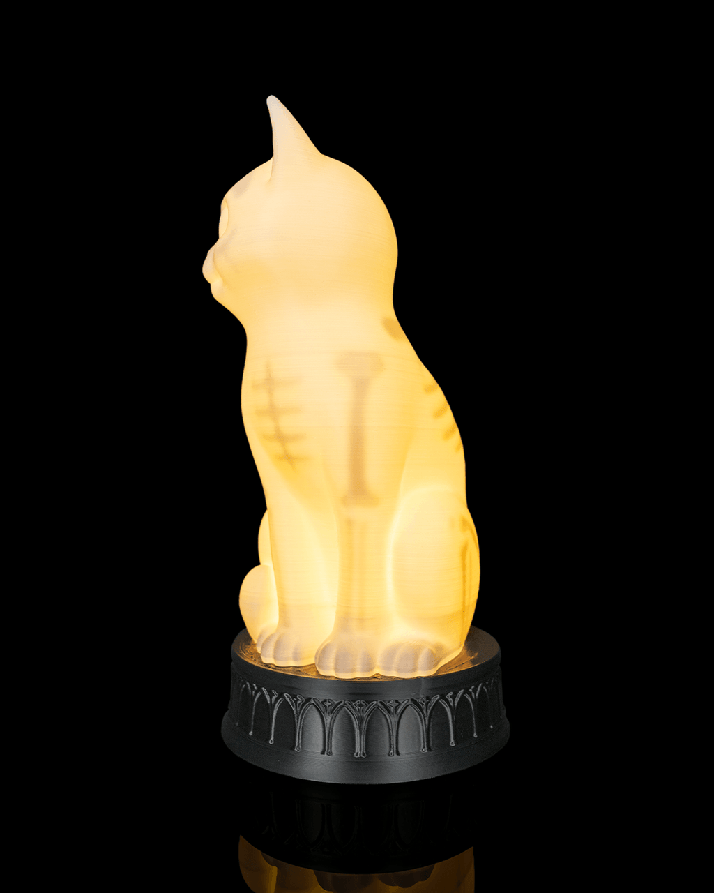 Front three-quarter view from the opposite side of the glowing cat lamp showing its front leg bones