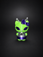 Full view of the green, purple, silver, and black Alien Hello Kitty display figure against a dark background.
