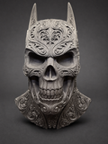 Upright front view of the Batman-inspired skull decor with pointed ears and ornate scrollwork against a dark background.