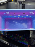 Interior view of the blue and purple tote showing its open compartment and handle attachment buttons.