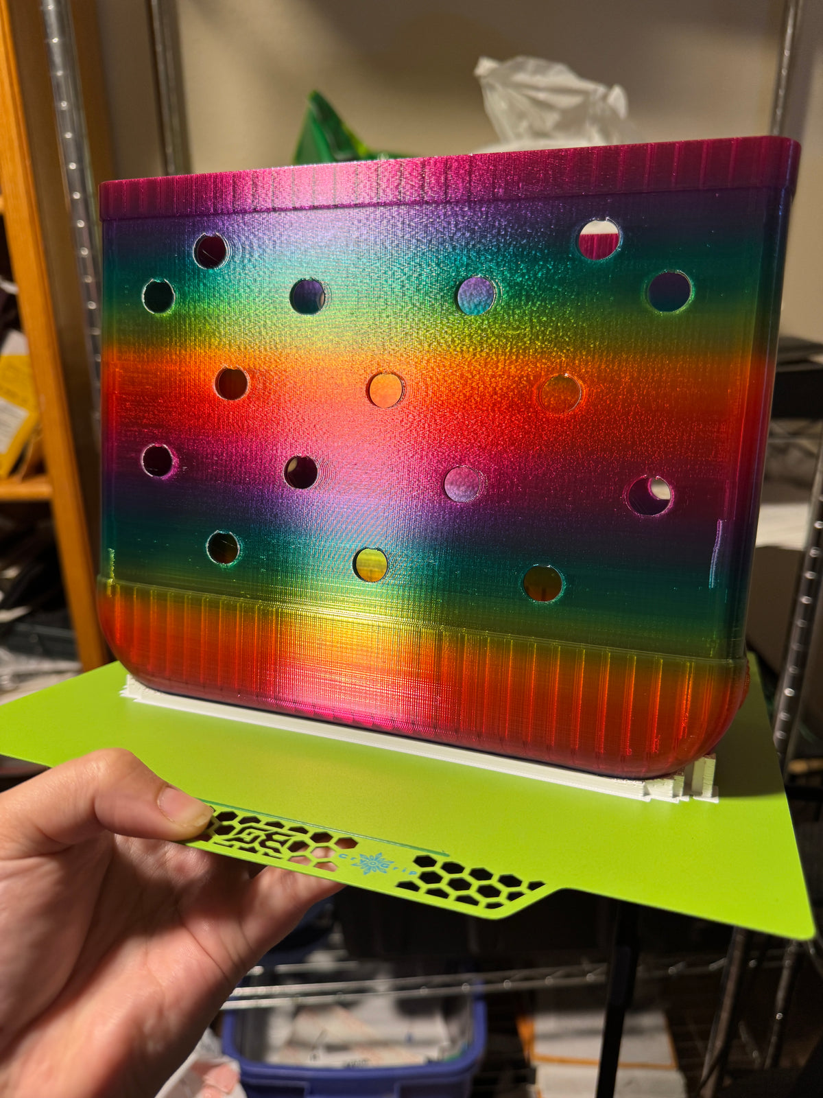 Front view of a rainbow tote body before handle assembly, showing pink, green, yellow, and orange bands.