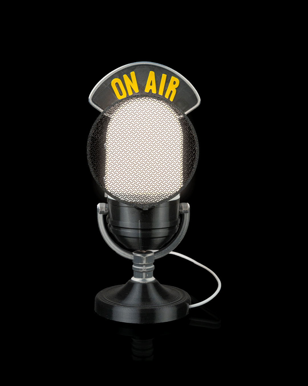 Broadcast microphone LED table lamp illuminated, front view