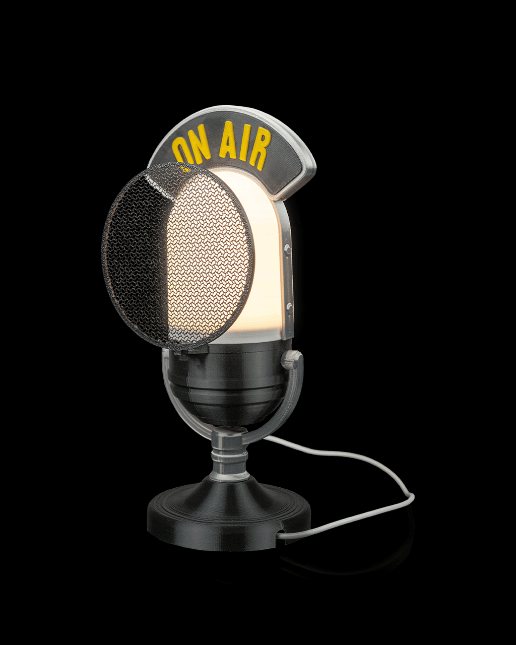 Broadcast microphone lamp illuminated, angled front view