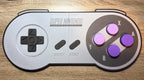 3D printed SNES controller wall display with purple clickable keyboard switches