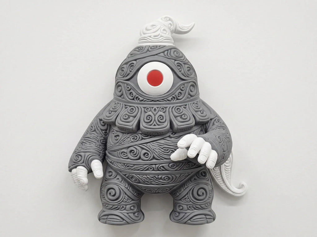 Front view of gray Dusclops wall decor with ornate scrollwork, white hands, and a red-centered eye.