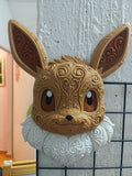 Eevee wall art displayed upright, with tan filigree, brown ears and eyes, and white neck fluff.