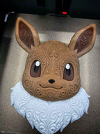 Front view of Eevee wall art on a printer plate showing ornate raised scrollwork and multicolor details.