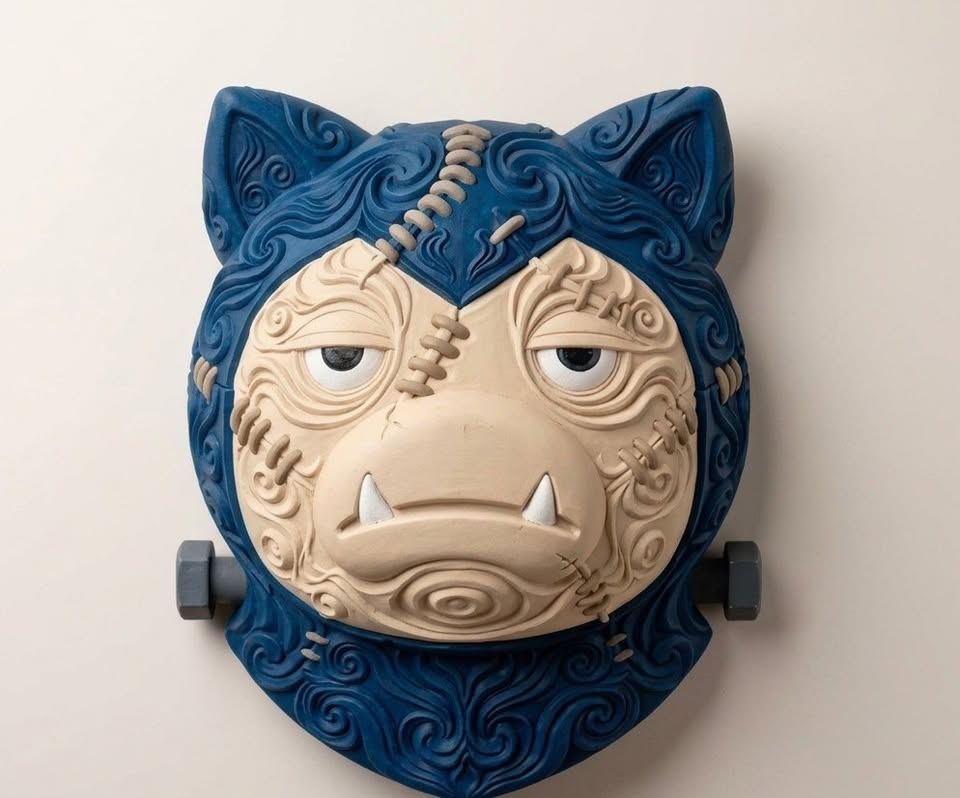 Front view of Frankenstein Snorlax Pokémon wall art with blue filigree, cream face, stitches and neck bolts.