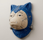 Angled view of Frankenstein Snorlax wall art showing raised scrollwork and dimensional face.