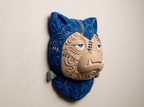 Side view of Frankenstein Snorlax Pokémon wall art displayed on a wall.