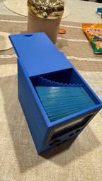 Blue deck box open with sleeved cards inside.