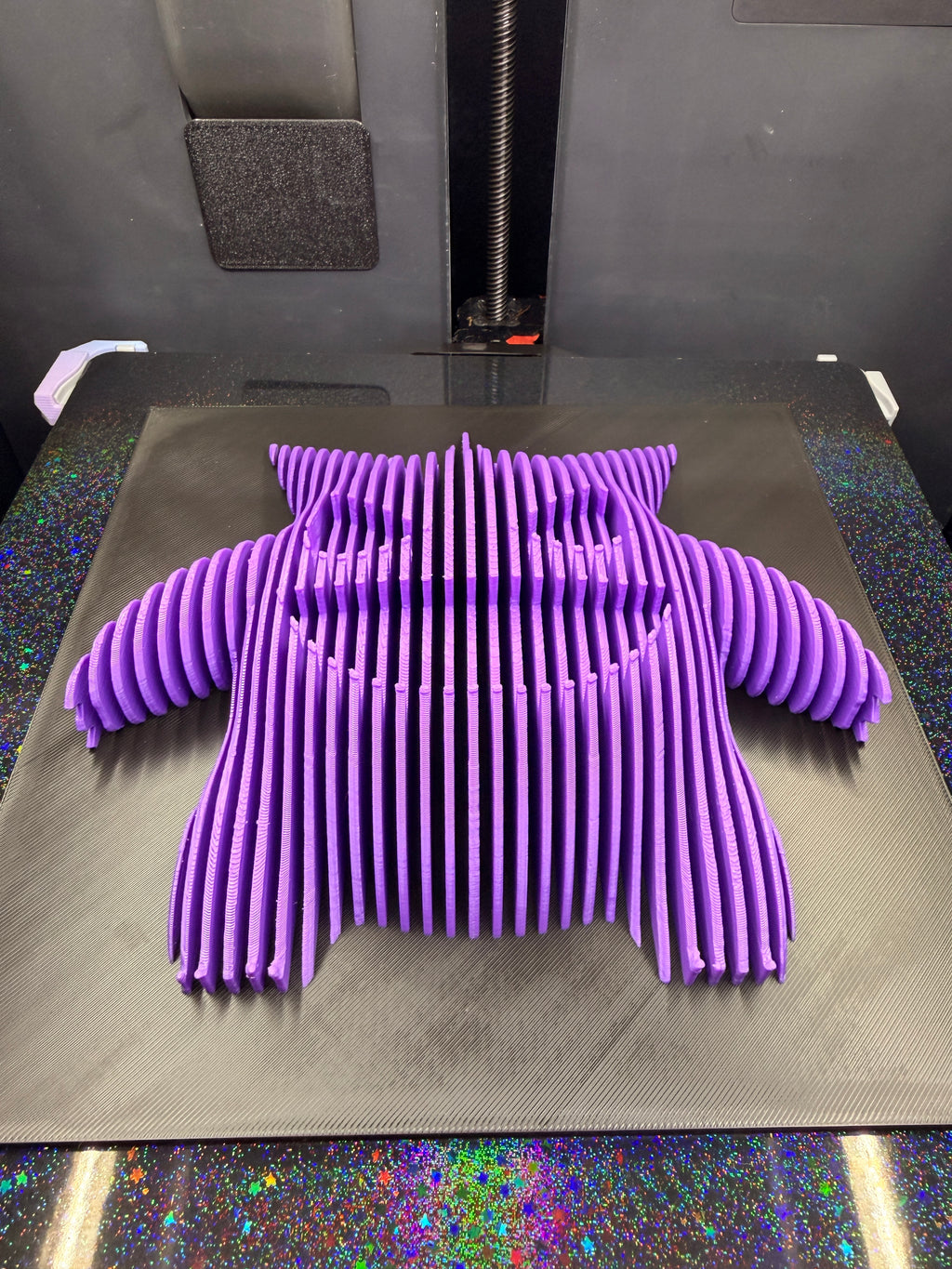 Angled view of Gengar optical illusion wall art lying flat, showing its dimensional purple silhouette.