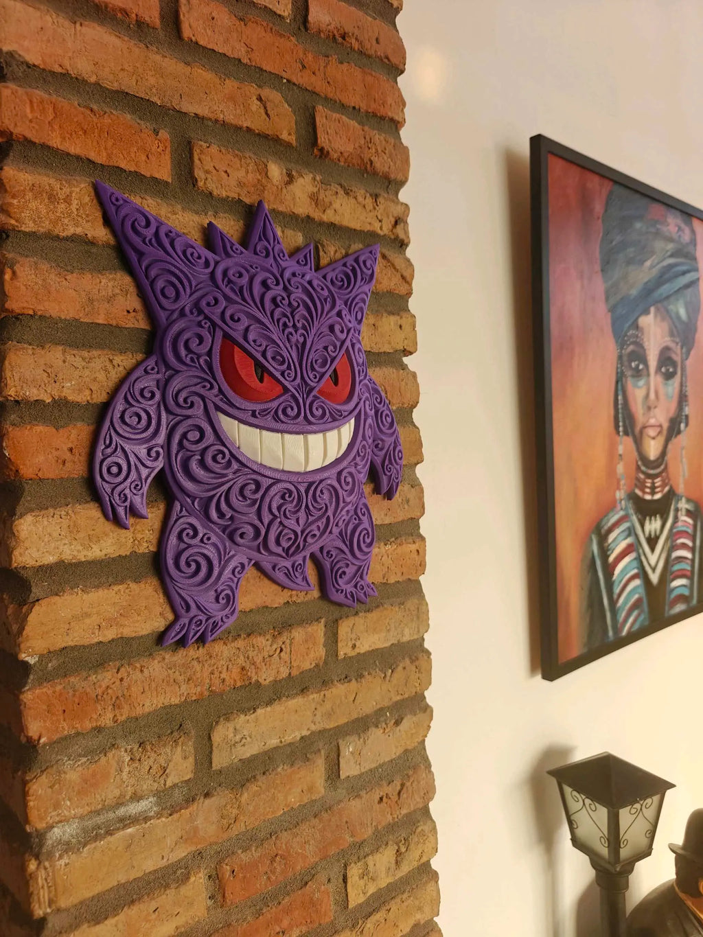 Purple Gengar wall art displayed on a brick wall.