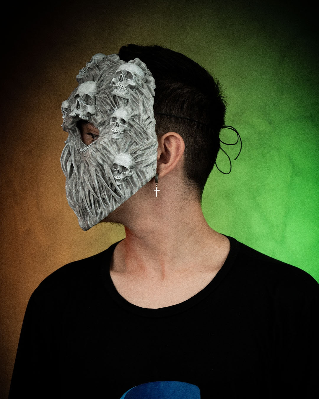 Side fit example of a person wearing the Ghoul Face mask with a black strap shown; strap is not included.