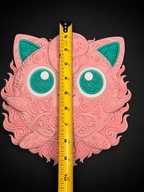 Front of pink and teal Jigglypuff wall art beside a vertical tape measure showing its approximate height.
