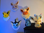 Jolteon Pokémon wall art displayed with other Eeveelution 3D printed wall decor