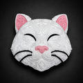 Front of white Korin cat wall art with raised filigree, pink ears and nose, and black closed eyes and whiskers.