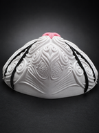 Low angled view of Korin cat wall art showing the rounded muzzle, raised white scrollwork, and black whiskers.