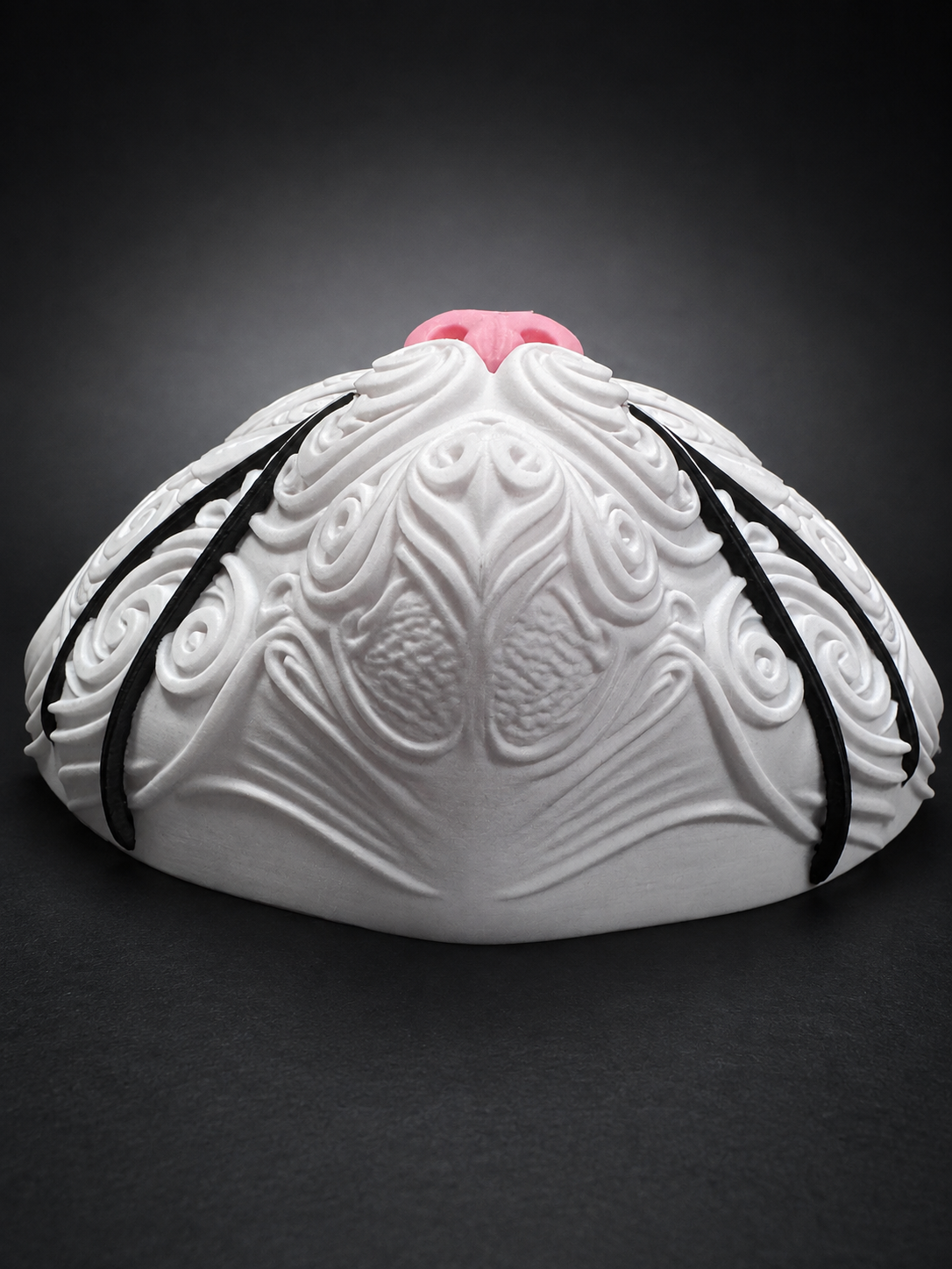 Low angled view of Korin cat wall art showing the rounded muzzle, raised white scrollwork, and black whiskers.