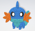 Front view of Mudkip Pokémon filigree wall art in blue, teal, orange, black and white with raised decorative scrollwork.