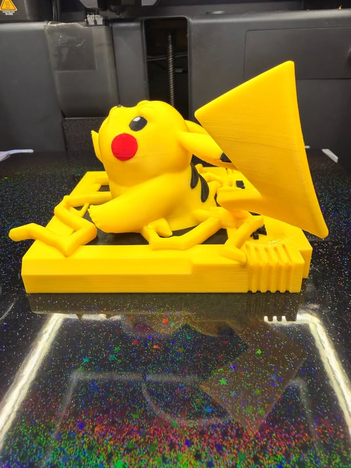 Opposite side of Pikachu Game Boy wall art showing its dimensional yellow figure, large tail, and cartridge-style base.