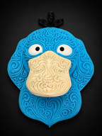Blue Psyduck wall art with ornate raised filigree, a cream bill, white eyes, and black head feathers against a dark background.