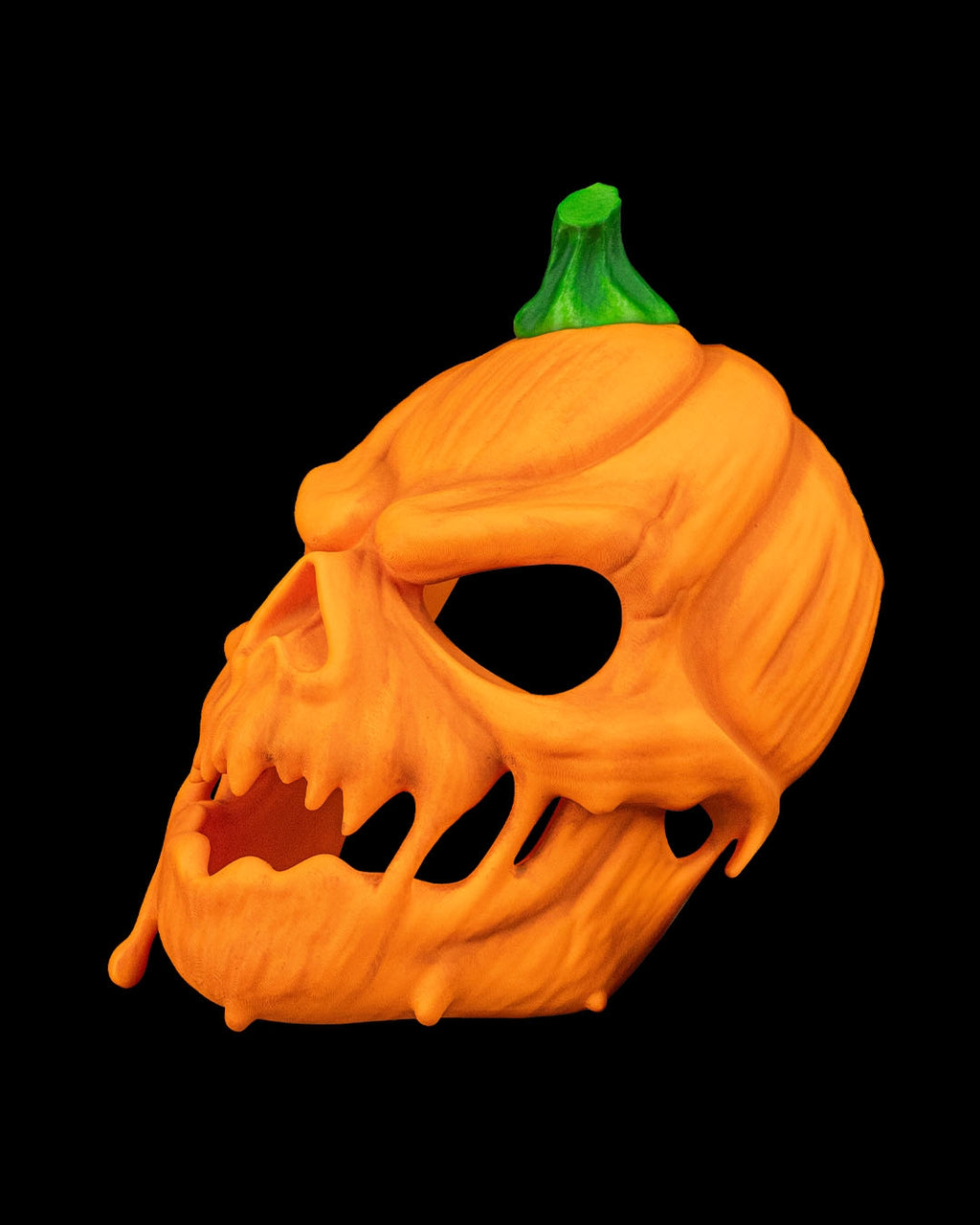 Opposite side view of the orange pumpkin skull mask showing its curved profile and green stem.