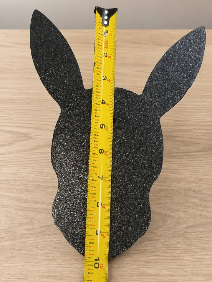 Black back of Shiny Umbreon wall art with a vertical tape measure showing its approximate height.