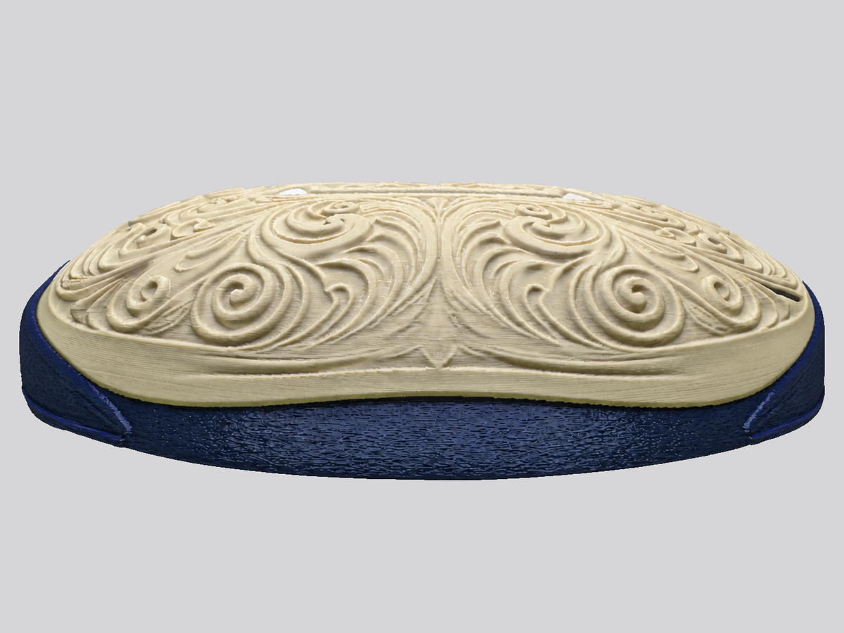 Low side view of Snorlax wall art showing the raised cream face layer above the dark blue backing.