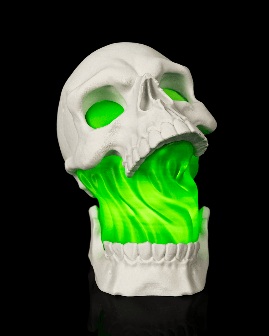 White Toxic Skull Lamp with an open jaw and bright green flowing center, shown from the front view against black.