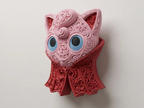Angled view of Vampire Jigglypuff wall art showing its dimensional pink face and ornate red vampire cape.