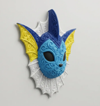 Angled wall view of Vaporeon showing raised blue filigree, yellow ear fins, black eyes, and a white neck frill.