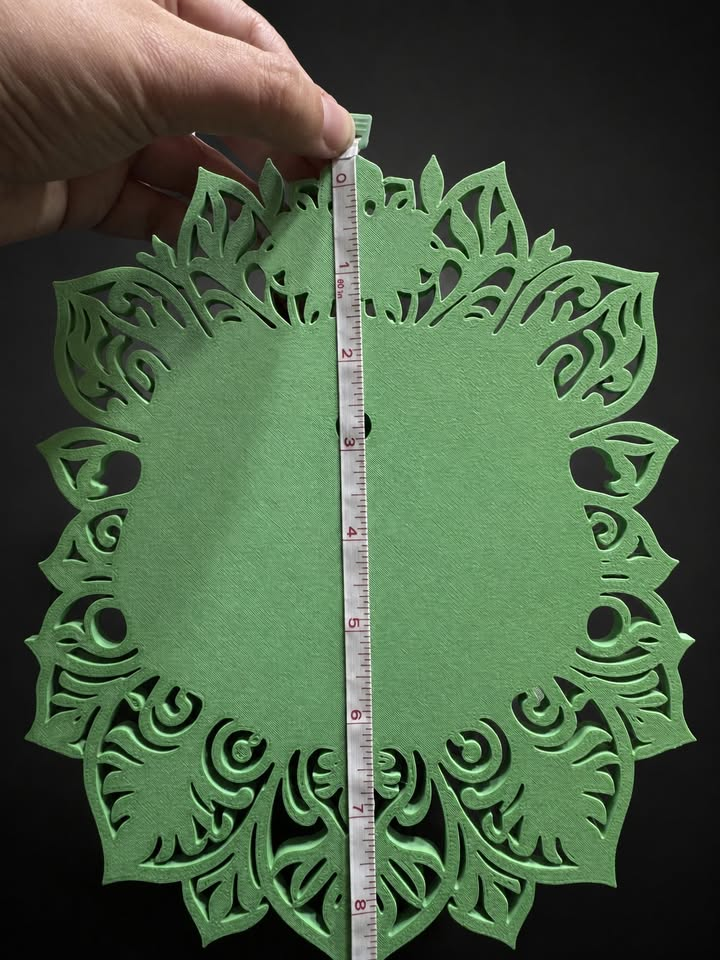 Green back of Venusaur wall art with a measuring tape showing its approximate height.