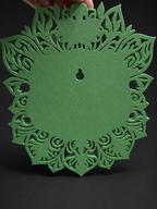 Green leaf-patterned back of Venusaur wall art showing the keyhole hanging slot.